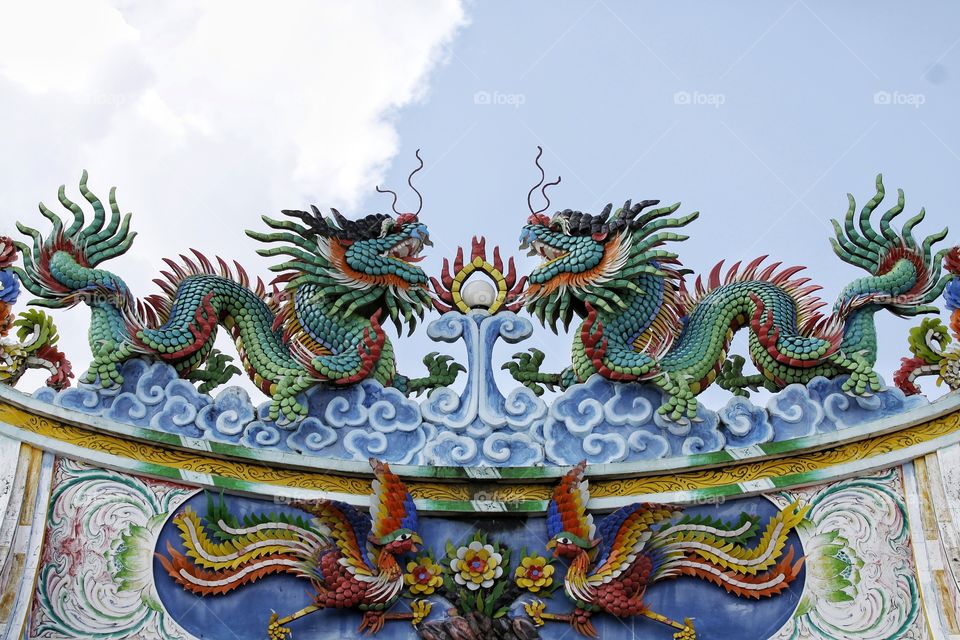 colorful dragon and birds on the
 rooftop of Chinese temple, Bangkok Thailand