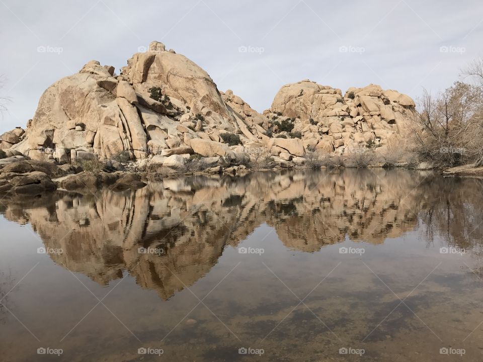 Rock formation reflected on lake