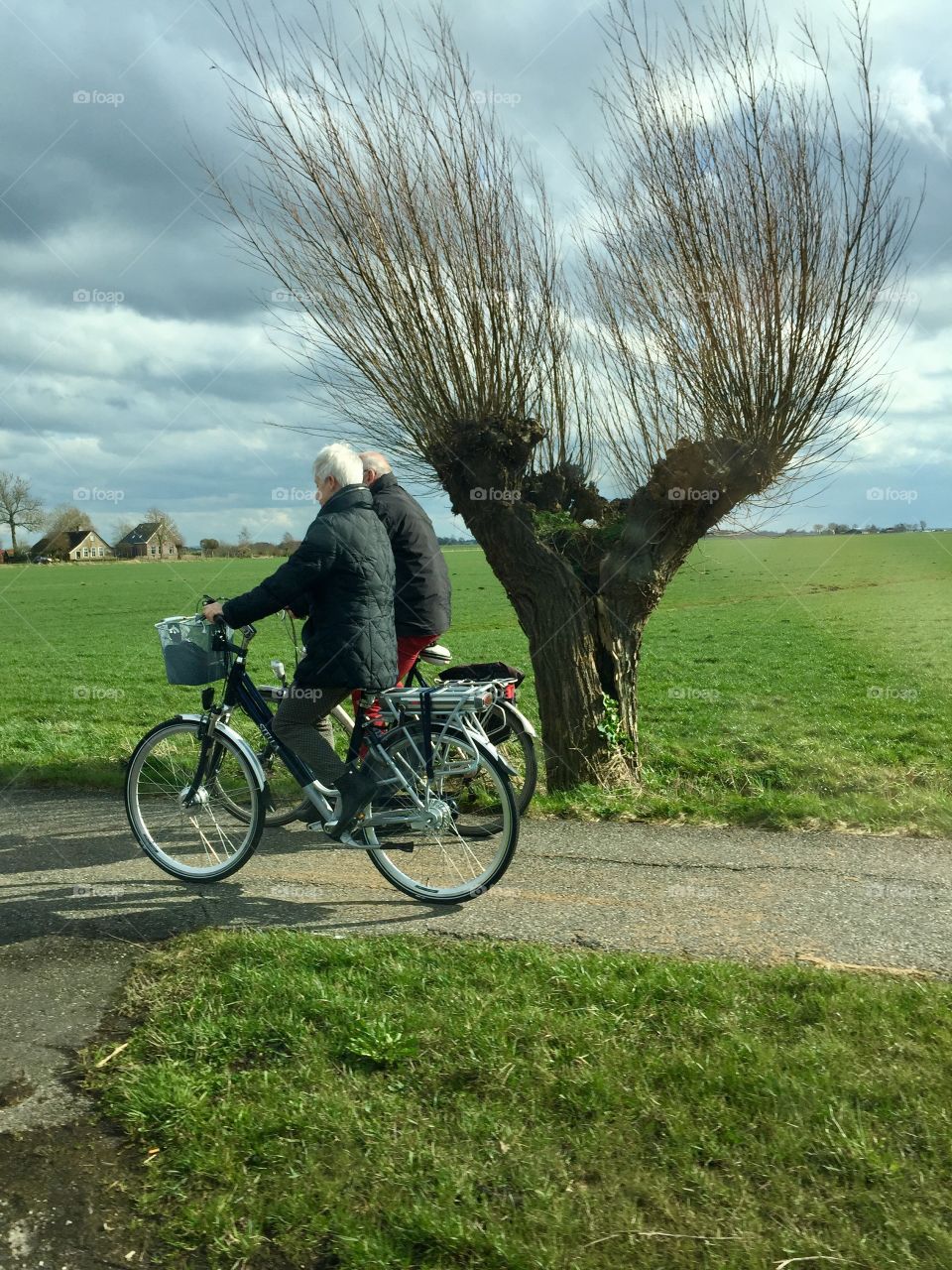 Elderly couple on the bicycles 