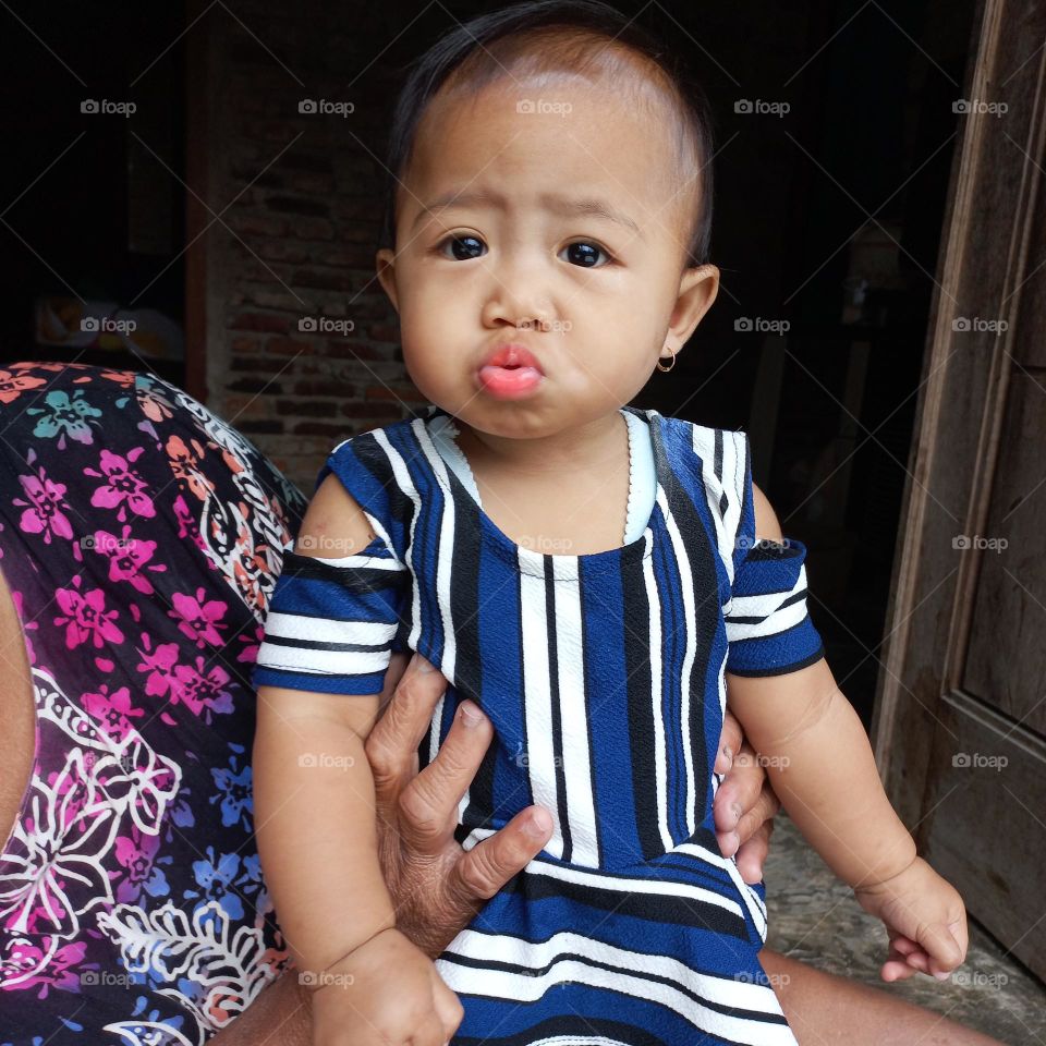 Emotions little girl under five years with front lips