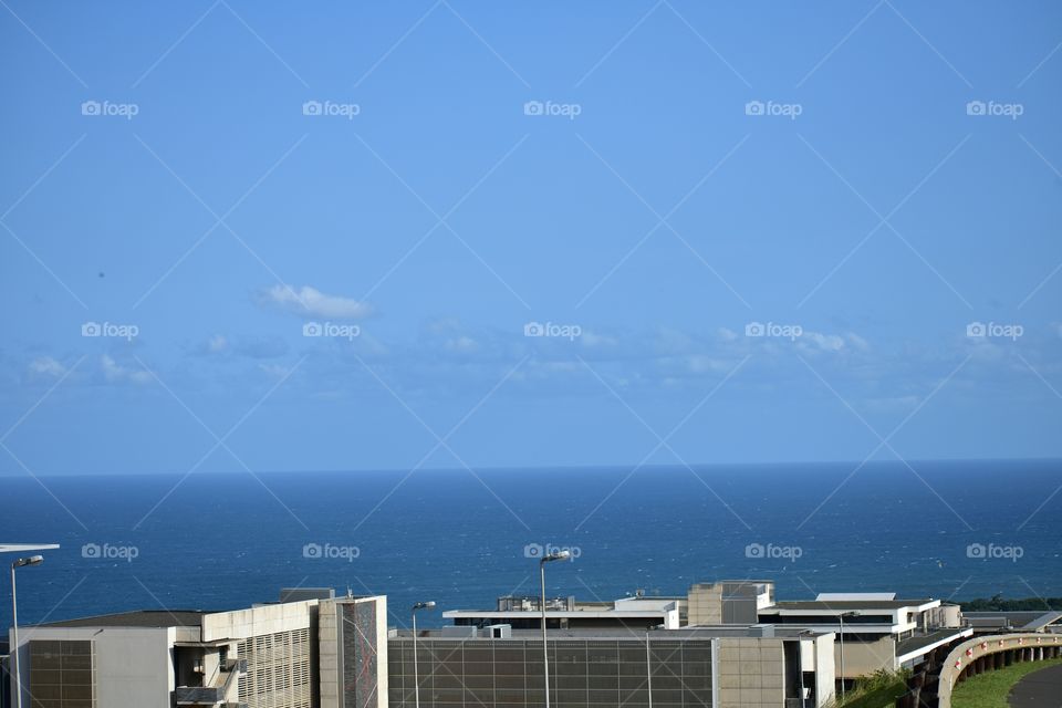 Enjoying The Scenic View On Top Of A Building.