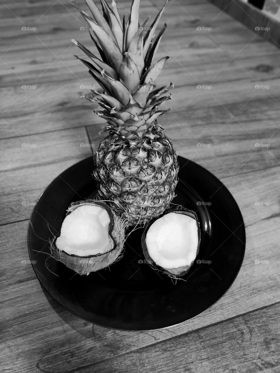 A pineapple and a coconut black and white