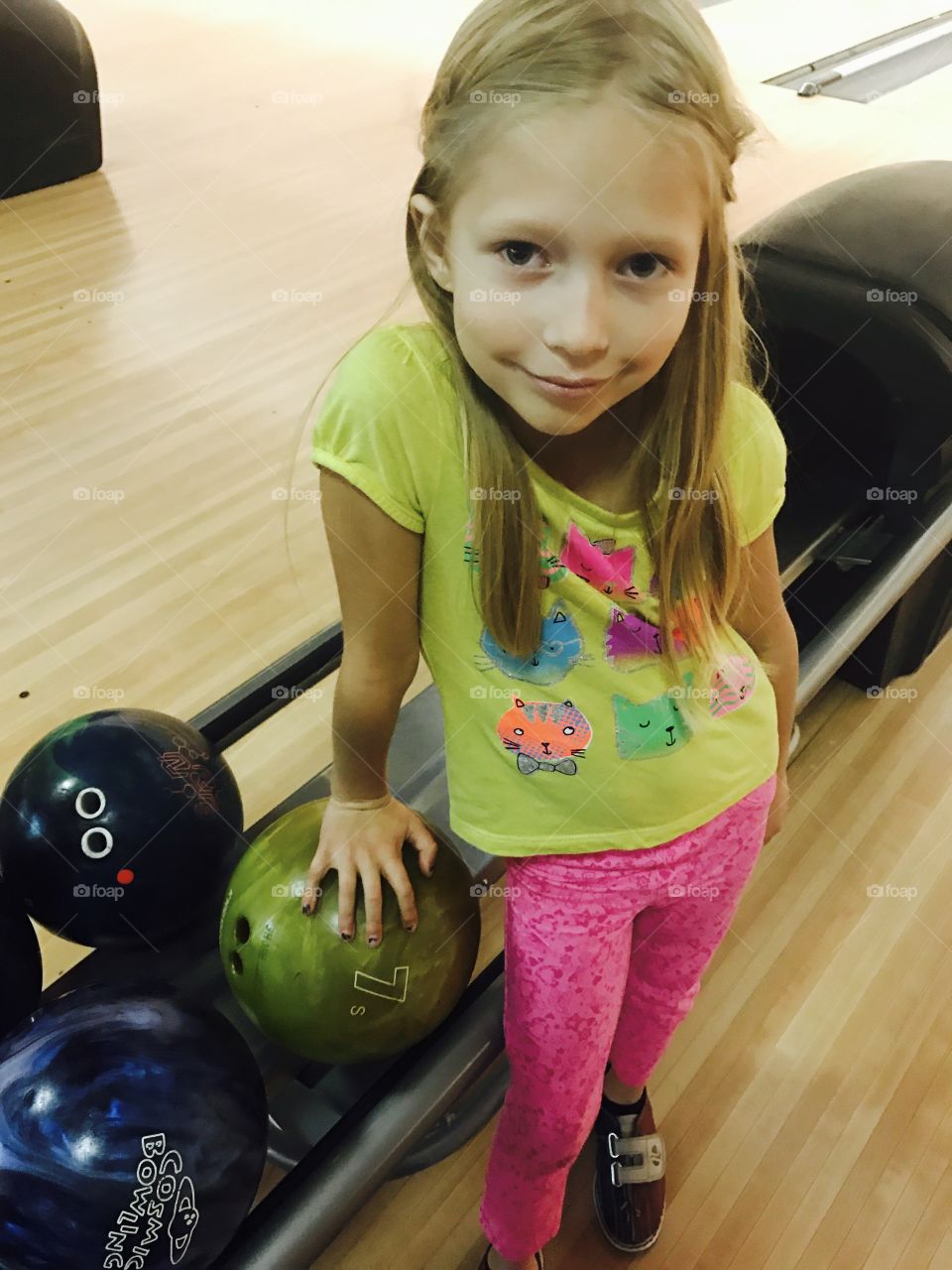 Little girl bowling 