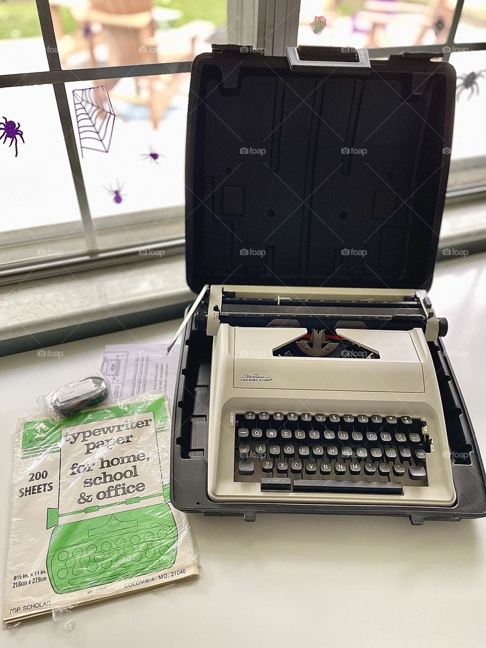 Typewriter with case and paper, typewriter with supplies, typewriter for budding writer, supplies for an author, nostalgia for writers