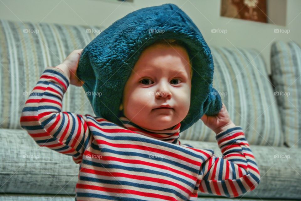portrait of a baby boy wearing hat
