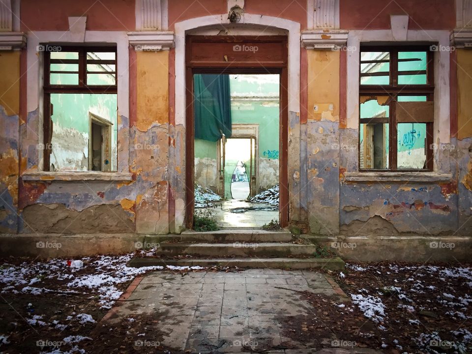 Facade of an abandoned building in winter