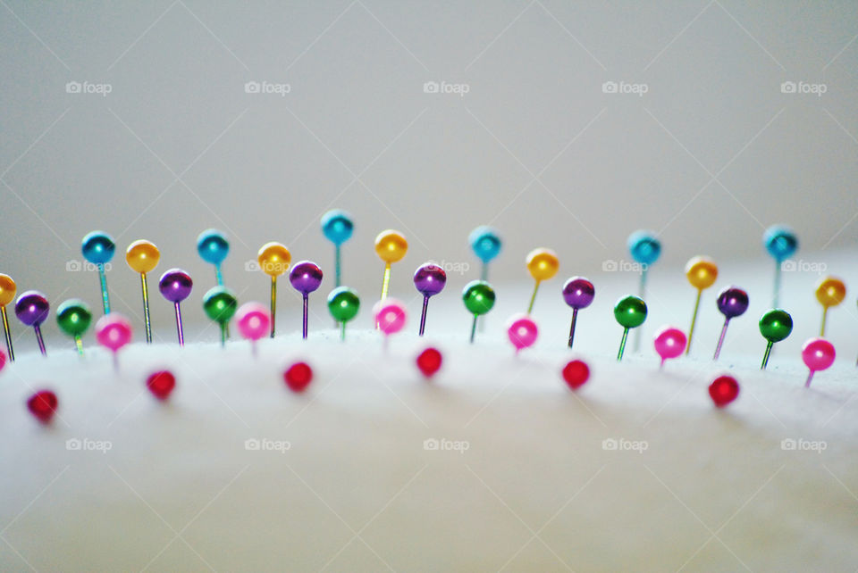 macro shot, colored ball point pins, sewing, extreme, close up
