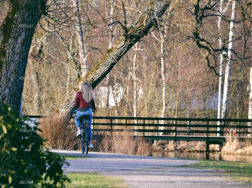 Woman bicycling in the park