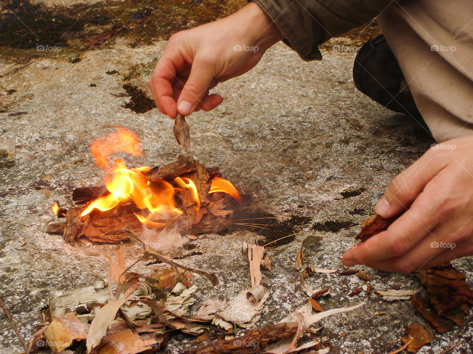 Having a fire break in the forest . Only to warm up the hands