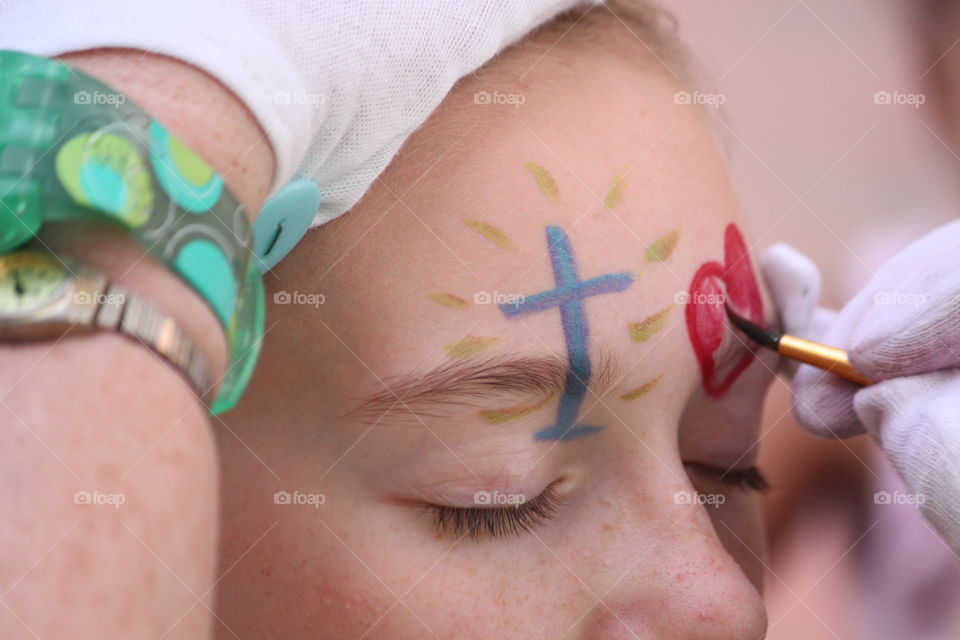 We were at a street festival in Winchester, VA, when the kids decided to get their faces painted. 