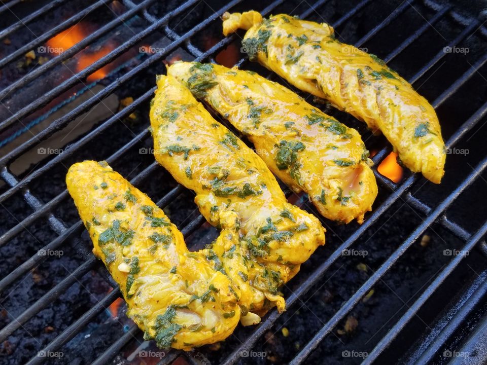 High angle view of meat on barbecue