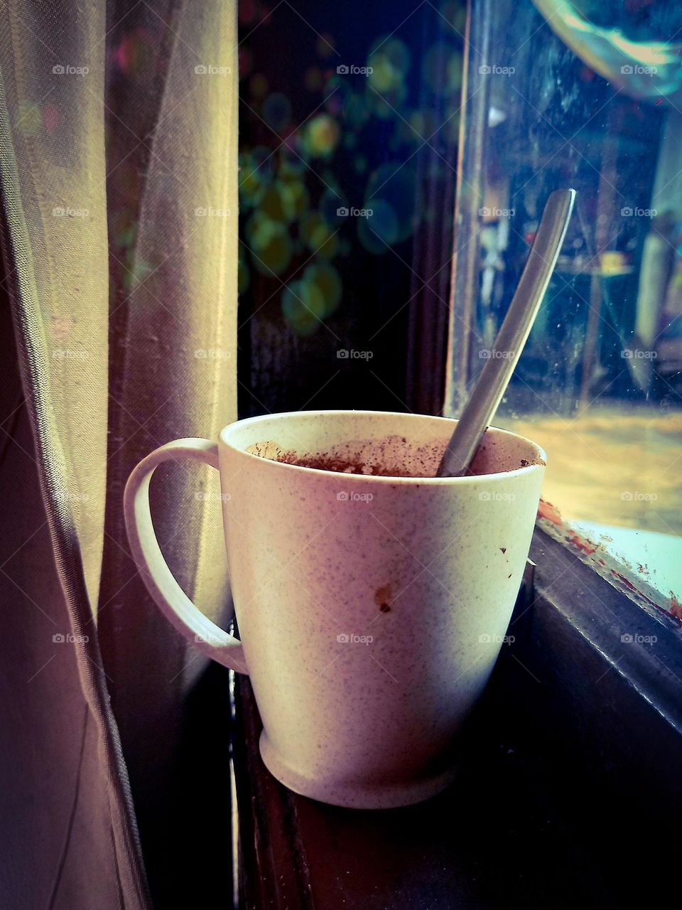 A glass of coffee in the window