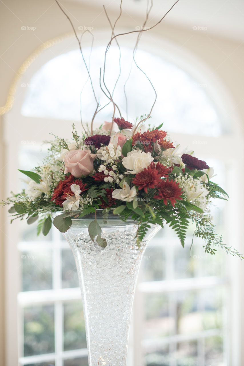 Red , Pink, and White Floral Centerpiece in Tall Glass Vase