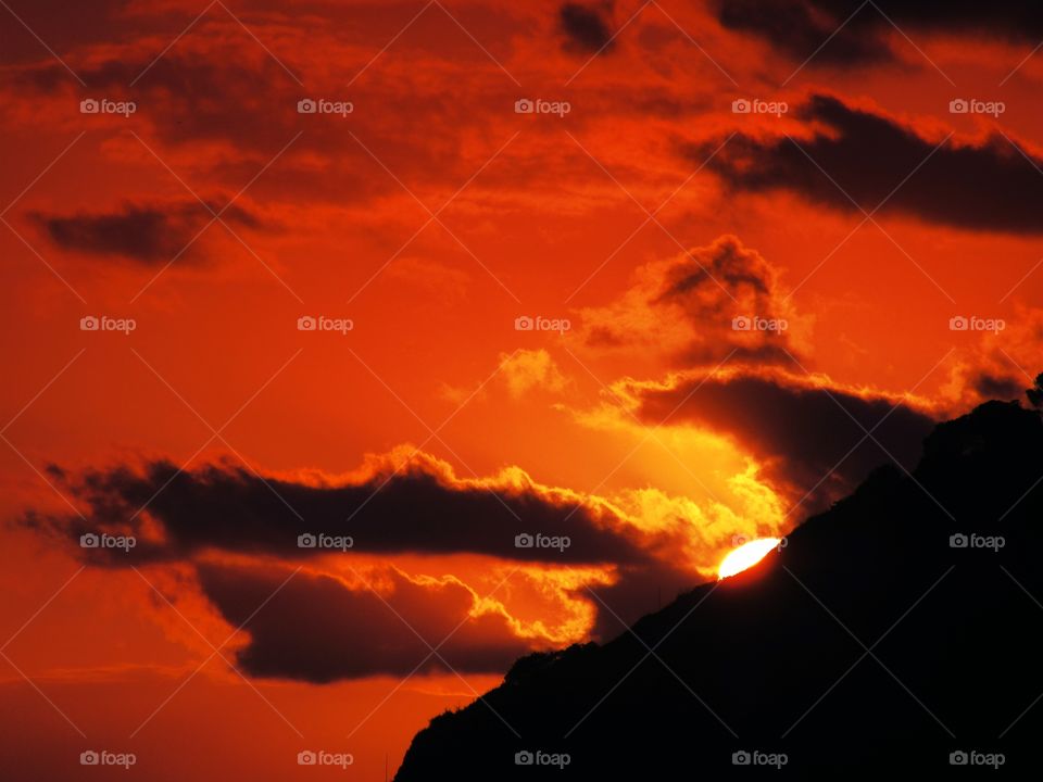 The Sun goes down behind the
Pozzuoli hill (Naples - Italy ).