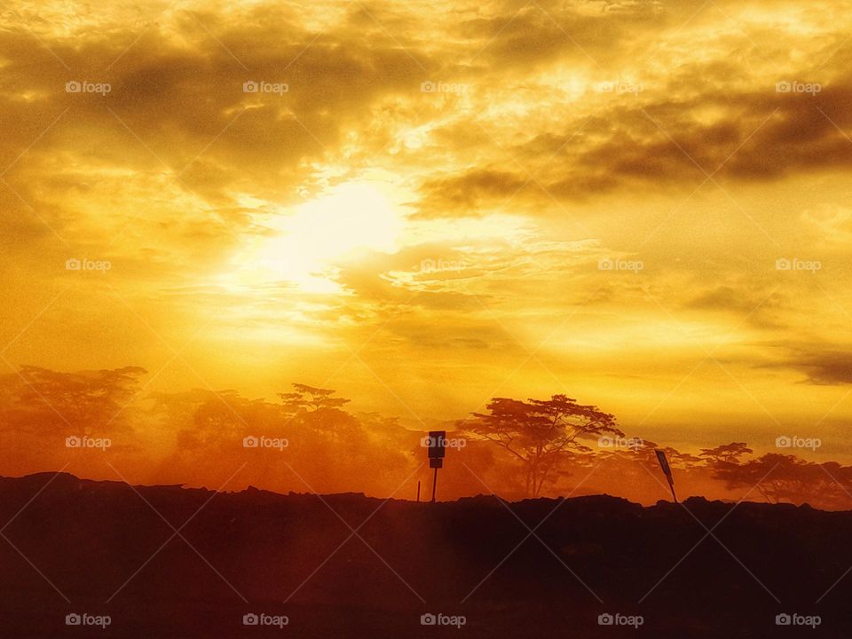 orange sunrise in the foggy land