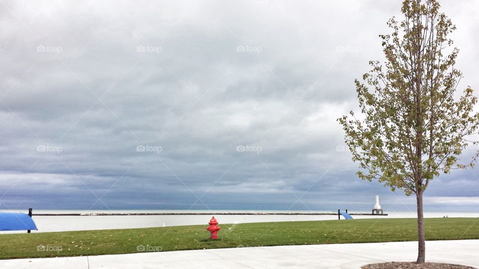 Gray Clouds Over Lake. Harbor Water Almost White 