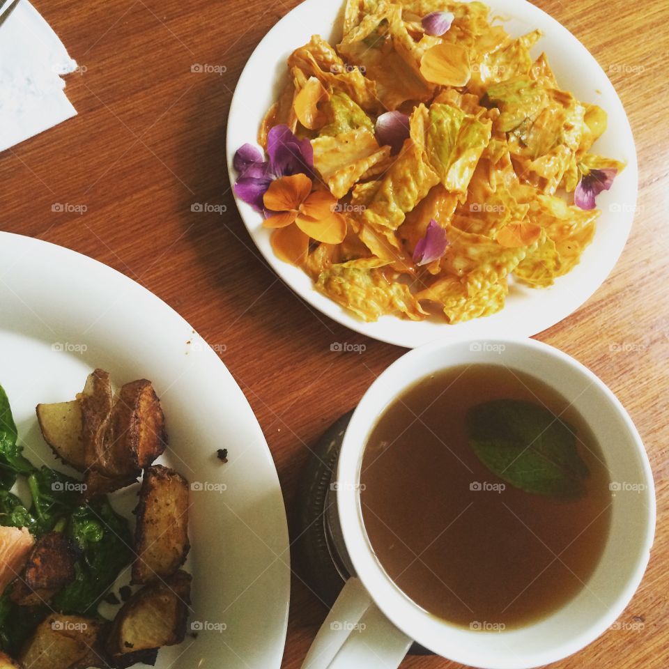 Salad, tea, and wilted greens & potatoes 