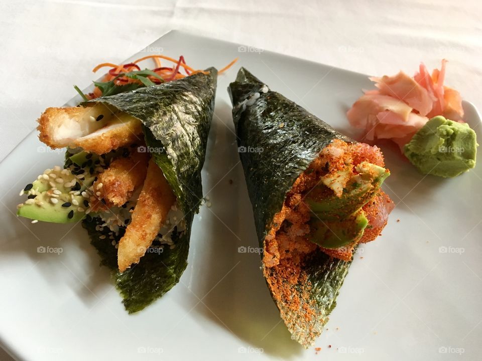 Sushi hand rolls with a touch of spice.