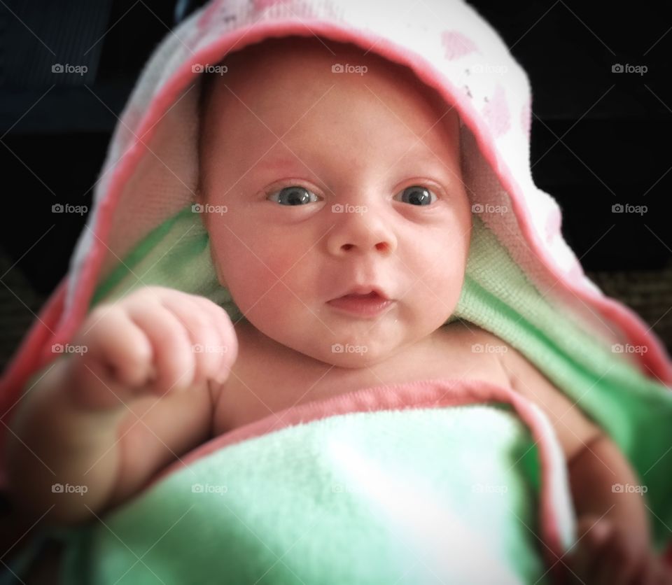 Close-up of a baby boy with blanket