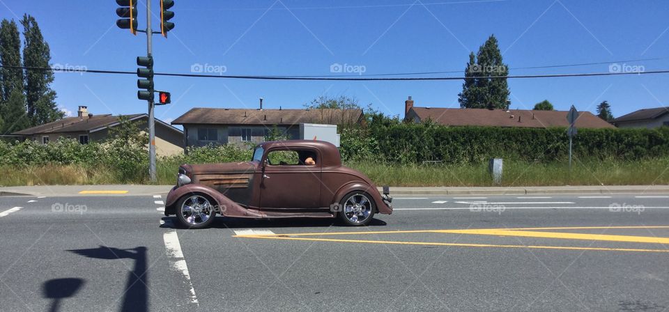 Rusted Vintage Car Going for a Ride through the Country 