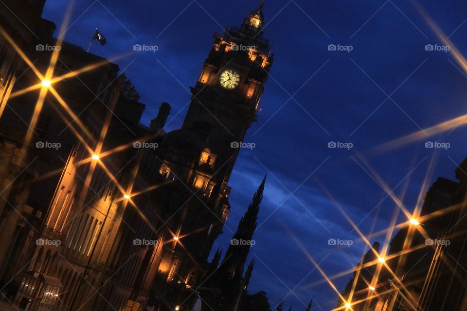 Star filter on an angle shot of Balmoral hotel, Edinburgh at dusk
