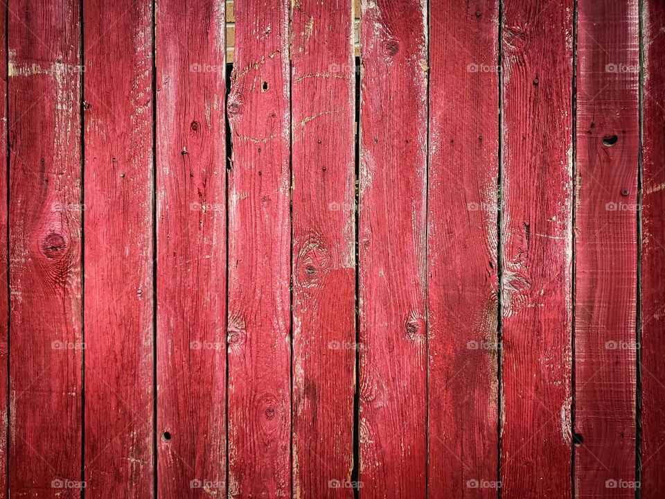 Distressed barn color red painted wood background