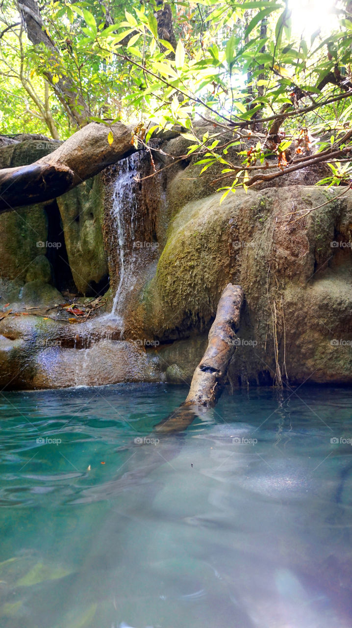 Peaceful blue waterfall Thailand Erawan National Park