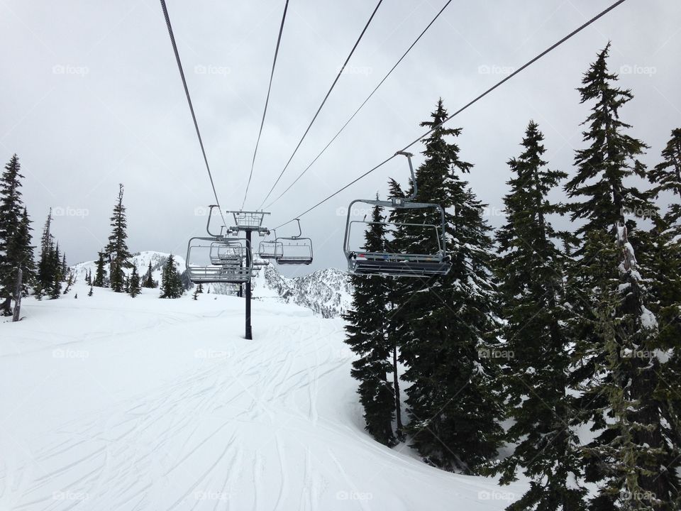 Chair lift on a slightly cloudy day 