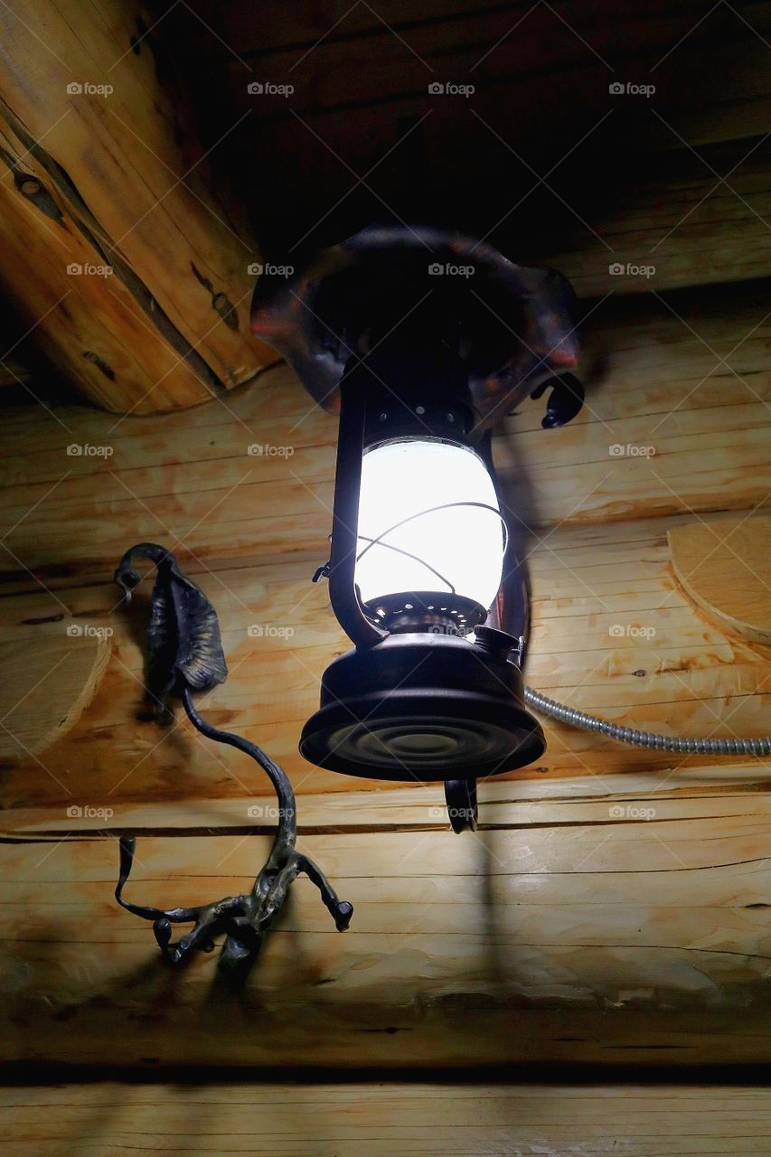 Antique lamp in a wooden house