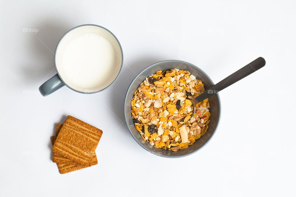 Top view of breakfast with cereals and milk