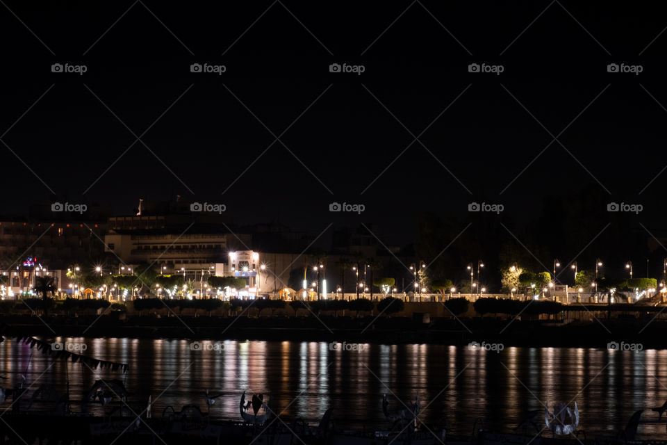 Beautiful reflection of night light on surface  of Nile river