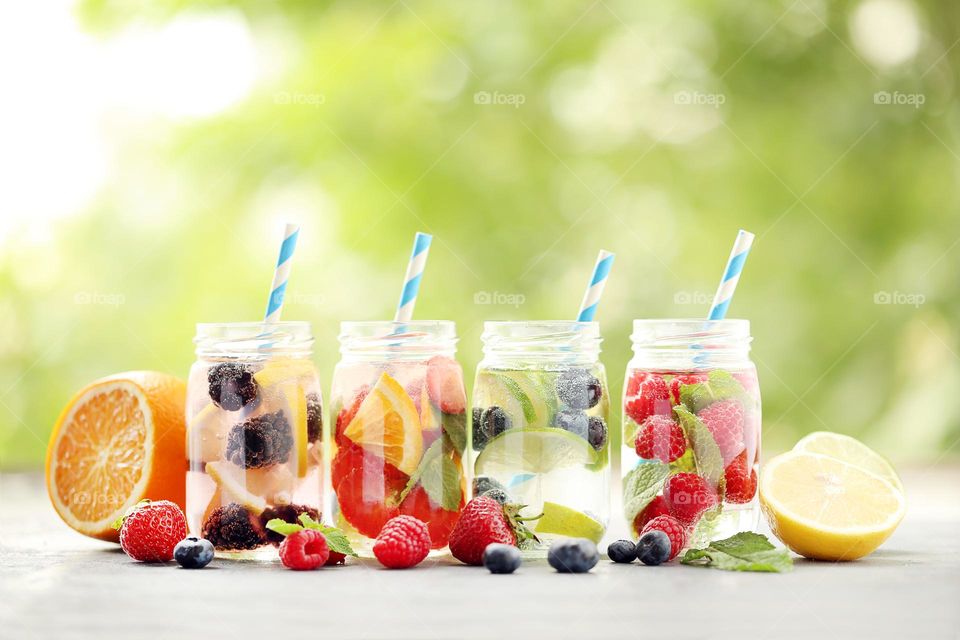 Fresh water with berries. Summer photography 