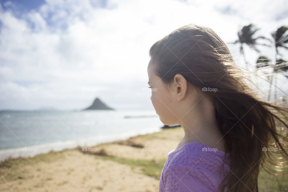 Girl looking out to the ocean in Hawaii 