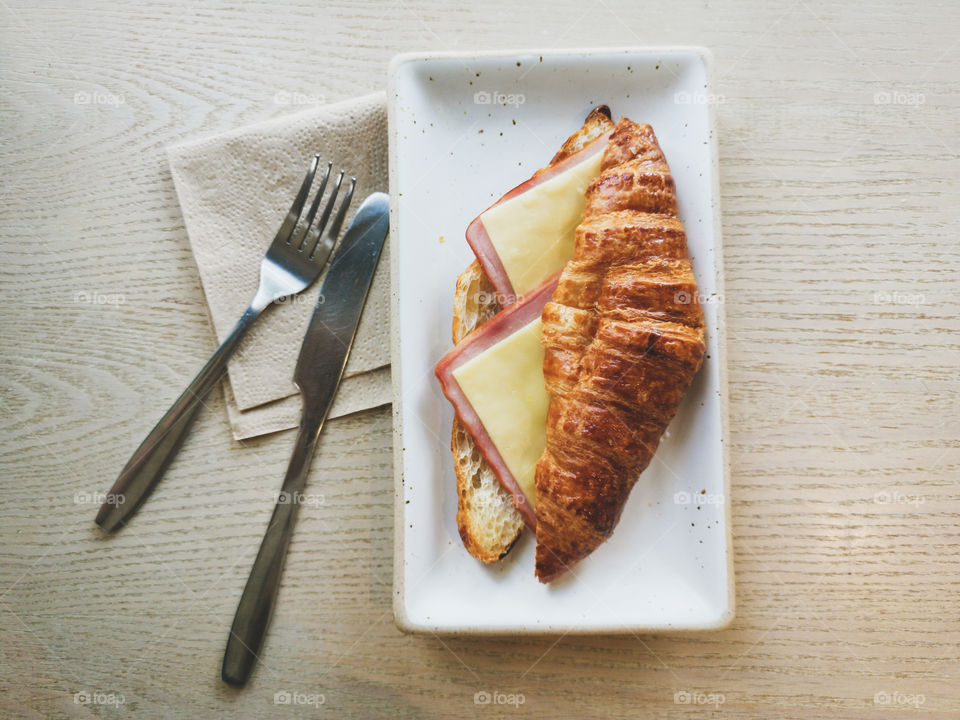 croissant sandwich ham cheese, flat lay