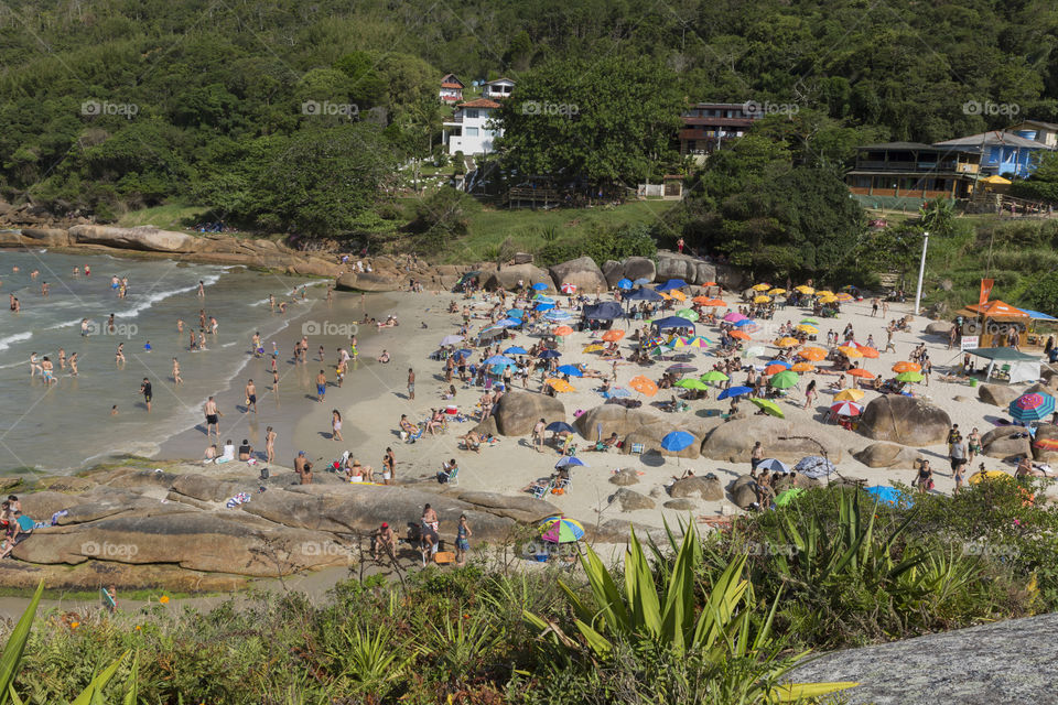 Tourists enjoy the summer on the little beach in Barra da Lagoa in Florianopolis Santa Catarina Brazil.