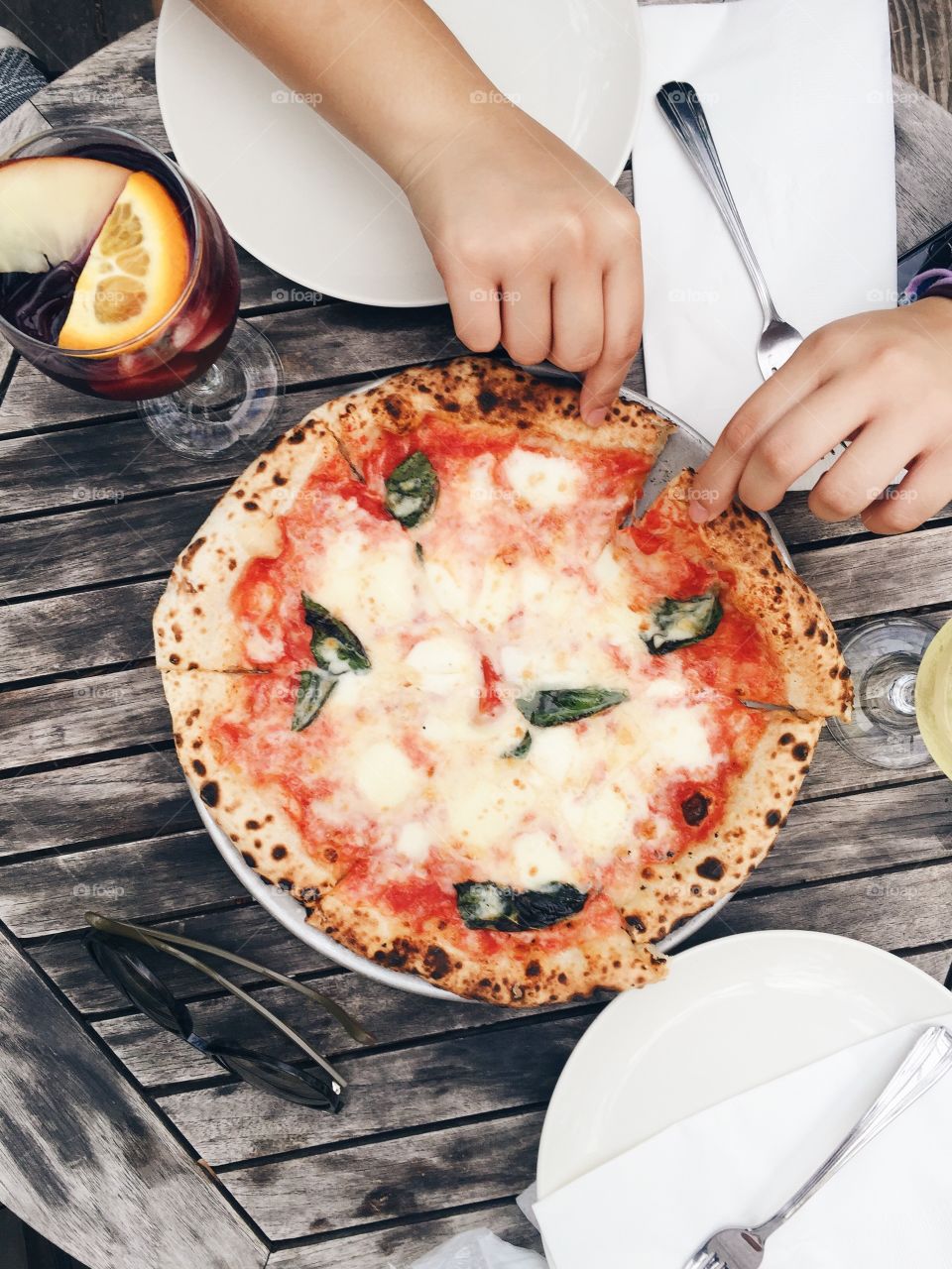 Directly above view of person with pizza