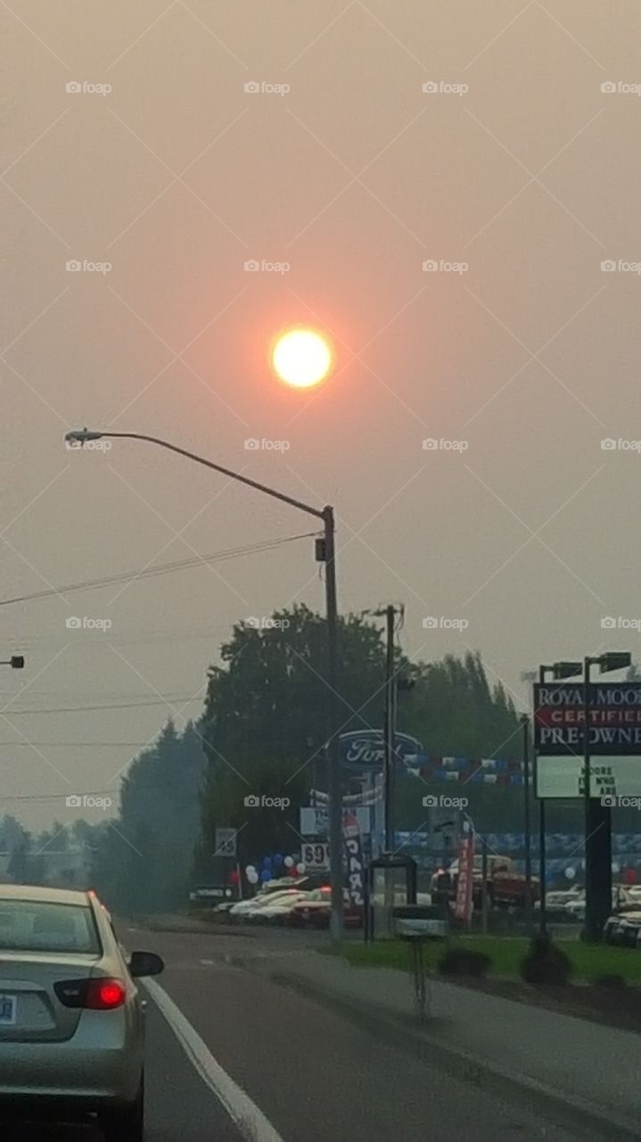 Smokey Sunset. Wildfires 4 hours away blown into  the city makes for one hazy sunset.