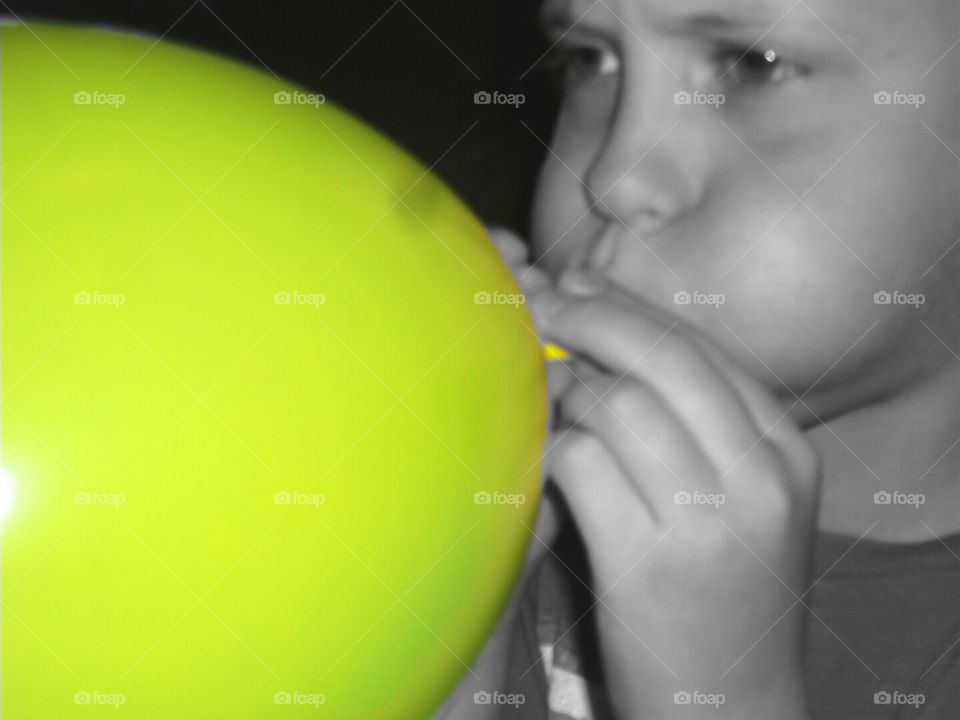 Blowing balloon. . Blowing yellow balloon! 