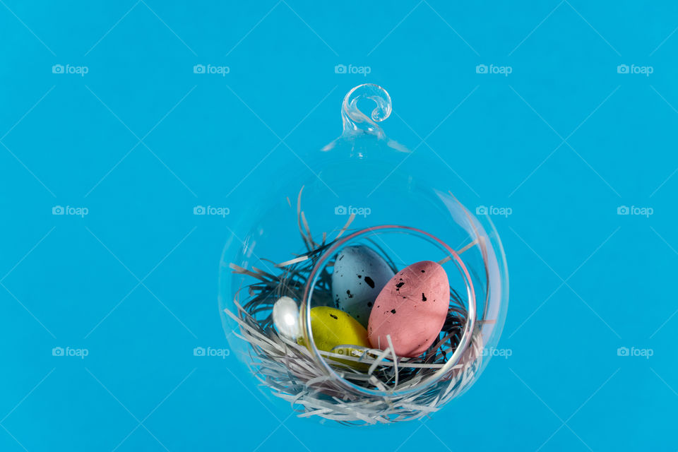 Easter eggs in floatin glass nest