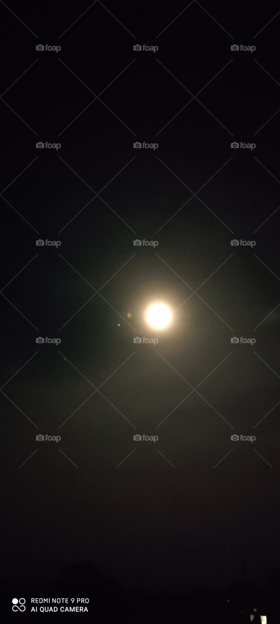 The moon looks beautiful. At night, the moon seems very low.