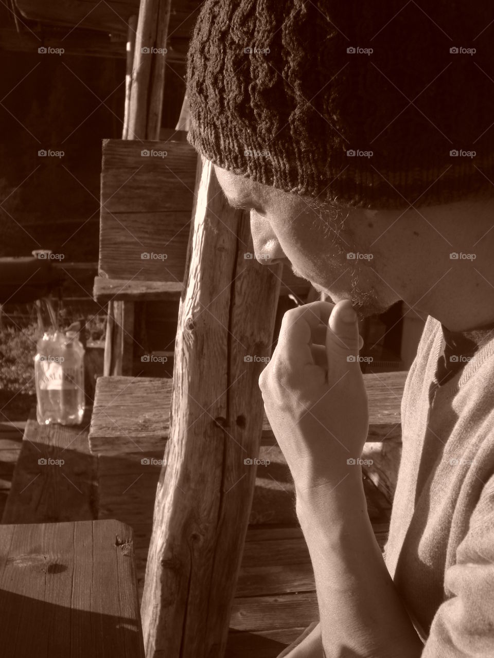 looking thoughtful outside an alpine hut