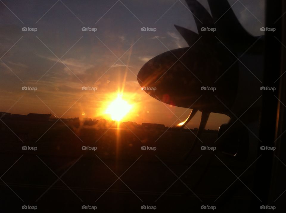 Plane in the sun rays 