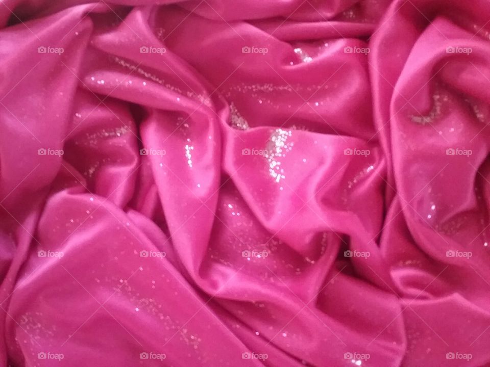 Glitter on pink fabric