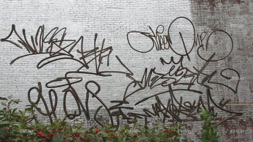Metal Graffiti Art. Urban Neighborhood Architecture