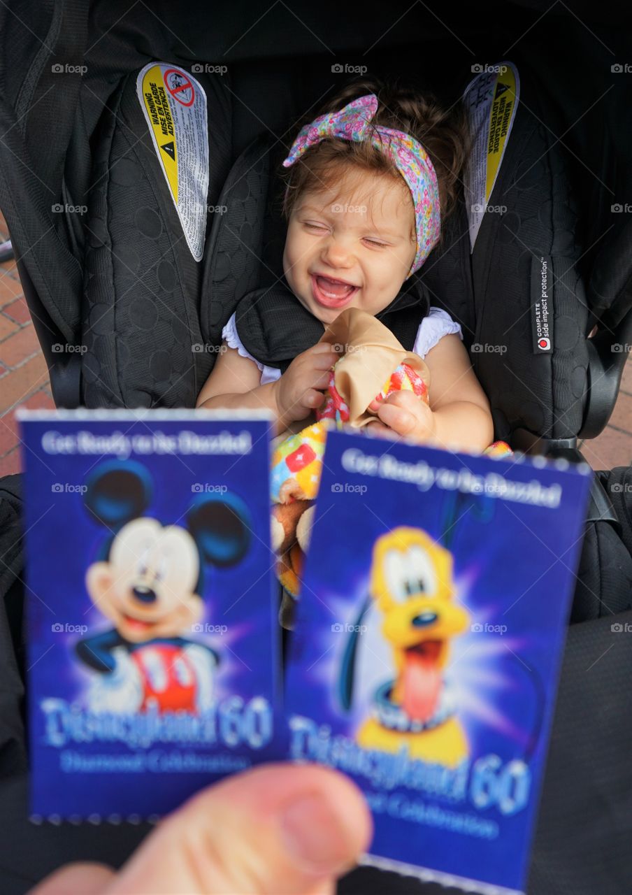 Smiling baby sitting on stroller