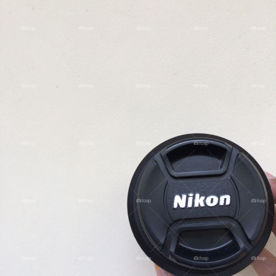 The Nikon’s lense cover in minimalist background