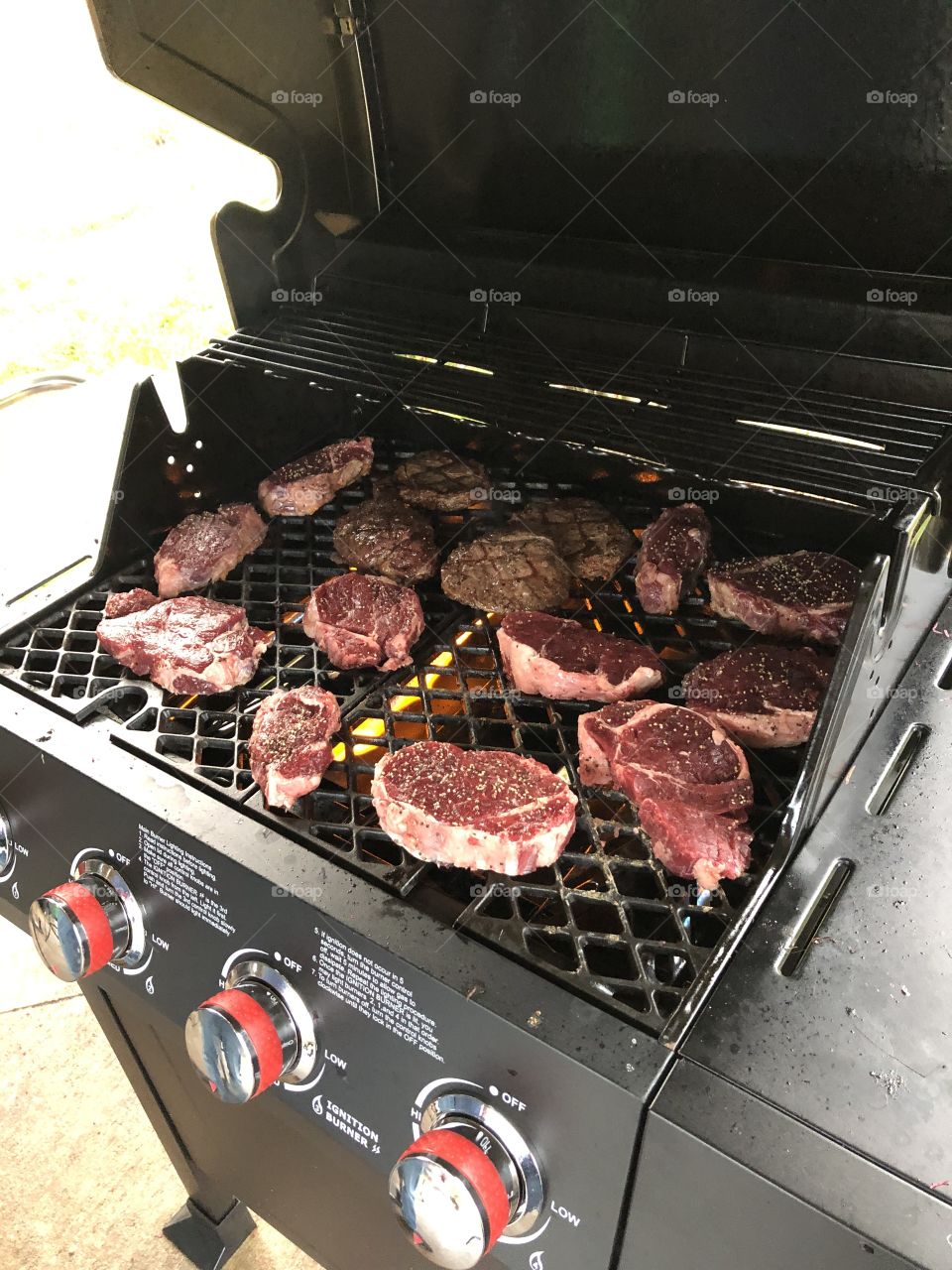 Sizzling steaks on the grill ready to melt in our mouths. 