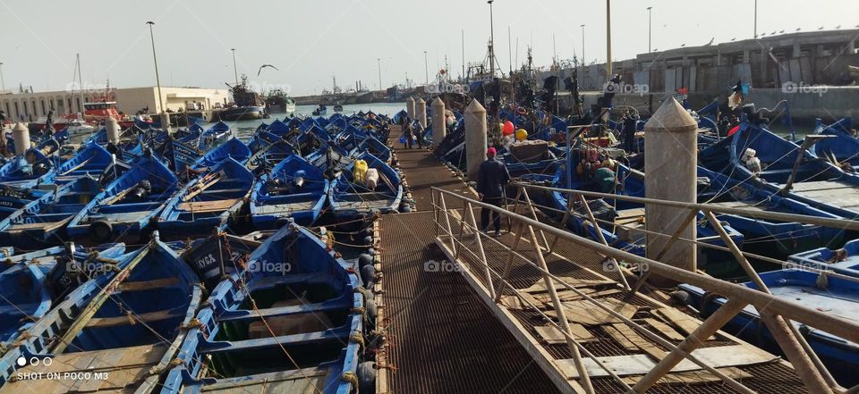 blue boats at the harbour in essaouira city in Morocco.