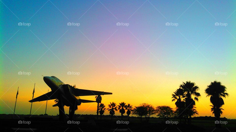 Airport at sunrise. Military monument at sunrise