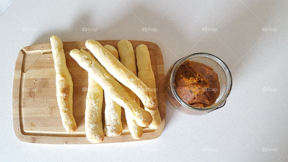 Homeade pastry with parmesan cheese and carrot dip